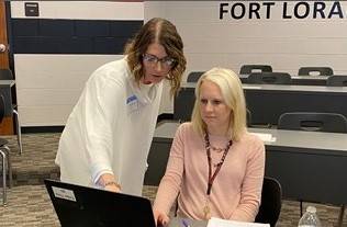 Woman working with a teacher